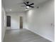 Spacious bedroom featuring wood-look flooring with a bathroom and walk-in closet at 1005 S Empire St, Plant City, FL 33563