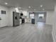 Modern open-concept kitchen featuring white cabinetry, stainless steel appliances, and an open layout at 1005 S Empire St, Plant City, FL 33563