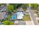Aerial view of the property showcasing a private pool and well-maintained landscaping in a desirable neighborhood at 1010 E Fern St, Tampa, FL 33604