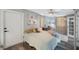 Serene bedroom features calming colors, soft textures and a view of the outdoor area at 1010 E Fern St, Tampa, FL 33604