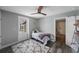Cozy bedroom featuring a ceiling fan, stylish rug and neutral paint, creating a relaxing atmosphere at 1010 E Fern St, Tampa, FL 33604