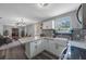 Bright, open kitchen with white cabinetry, stainless appliances, and stylish breakfast bar at 1010 E Fern St, Tampa, FL 33604
