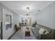 Inviting living room with an open concept, seamlessly connecting to the dining area and modern kitchen at 1010 E Fern St, Tampa, FL 33604