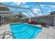 Beautiful screened-in pool with an outdoor seating area, perfect for enjoying sunny days and entertaining guests at 1010 E Fern St, Tampa, FL 33604