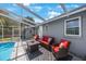 Relax in style by the pool, complete with comfortable seating and a screened enclosure at 1010 E Fern St, Tampa, FL 33604