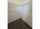 Walk-in closet with carpet and wire shelving for ample storage space at 10864 Banyan Breeze Blvd, Land O Lakes, FL 34638