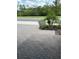 Brick driveway in front of house with well-maintained landscaping at 10864 Banyan Breeze Blvd, Land O Lakes, FL 34638