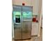 Stainless steel refrigerator and white cabinets in an updated kitchen at 10864 Banyan Breeze Blvd, Land O Lakes, FL 34638