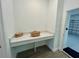 A mud room with a counter area and access to the garage at 10864 Banyan Breeze Blvd, Land O Lakes, FL 34638