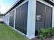 Enclosed patio with fine screens, creating a versatile space for enjoying the outdoors bug-free at 10864 Banyan Breeze Blvd, Land O Lakes, FL 34638