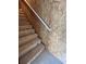Unfinished wooden stairway with white railing and plywood walls at 10864 Banyan Breeze Blvd, Land O Lakes, FL 34638