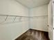 Walk-in closet with carpet floors and wire shelving offers ample storage space at 10864 Banyan Breeze Blvd, Land O Lakes, FL 34638