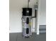 Close-up of a Smith brand water heater in a garage with white walls and gray flooring at 10864 Banyan Breeze Blvd, Land O Lakes, FL 34638