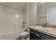 Well-lit bathroom features a modern vanity, toilet, and shower-tub combo at 10915 Kirkwall Port Dr, Wimauma, FL 33598
