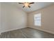 Bedroom featuring wood-look tile floors and a window at 10915 Kirkwall Port Dr, Wimauma, FL 33598