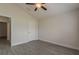 Bedroom featuring wood-look tile floors and an interior door at 10915 Kirkwall Port Dr, Wimauma, FL 33598