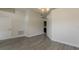 An additional view of the dining room with wood-look tile flooring at 10915 Kirkwall Port Dr, Wimauma, FL 33598