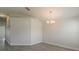 Bright dining room with wood-look tile flooring and a decorative light fixture at 10915 Kirkwall Port Dr, Wimauma, FL 33598