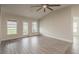 Living room featuring wood-look tile floors and an exterior door at 10915 Kirkwall Port Dr, Wimauma, FL 33598