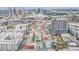 An aerial view shows a modern community, showcasing its pools and city views at 1120 E Kennedy Blvd # 912, Tampa, FL 33602