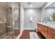 Modern bathroom with tiled walk-in shower, updated vanity, and sleek fixtures, complete with hardwood floors at 1120 E Kennedy Blvd # 912, Tampa, FL 33602