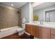 Bathroom featuring a shower and tub combo and a modern vanity at 1120 E Kennedy Blvd # 912, Tampa, FL 33602