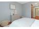 Neutral bedroom featuring decorative chest with drawers, hardwood floors and modern decor at 1120 E Kennedy Blvd # 912, Tampa, FL 33602