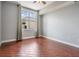 Bright bedroom featuring a large window and wood-look tile flooring throughout at 1120 E Kennedy Blvd # 912, Tampa, FL 33602