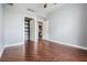 Open bedroom showcasing the wood-look tile flooring and entry to a closet at 1120 E Kennedy Blvd # 912, Tampa, FL 33602