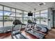 Well-equipped gym featuring treadmills, elliptical, and a wall of windows, promoting health and wellness for residents at 1120 E Kennedy Blvd # 912, Tampa, FL 33602
