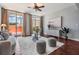 Cozy living room with hardwood floors, neutral walls, stylish furniture, and views from large sliding glass doors at 1120 E Kennedy Blvd # 912, Tampa, FL 33602