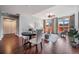 Open-concept living and dining area featuring hardwood floors, a ceiling fan, and lots of natural light at 1120 E Kennedy Blvd # 912, Tampa, FL 33602