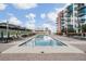 A community pool with ample seating provides residents with a refreshing outdoor space on a sunny day at 1120 E Kennedy Blvd # 912, Tampa, FL 33602