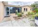 Backyard exterior featuring a screened-in patio, well-maintained landscaping, and a serene outdoor living space at 113 Maplewood Ave, Clearwater, FL 33765