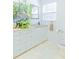 Bathroom with white vanity, mirror and tiled floors at 113 Maplewood Ave, Clearwater, FL 33765