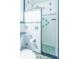 A unique shower design features mosaic tiles on the walls and floors, creating a fun, retro look at 113 Maplewood Ave, Clearwater, FL 33765