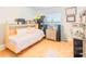 Bright bedroom with wood flooring, a Murphy bed and a sunny window at 113 Maplewood Ave, Clearwater, FL 33765