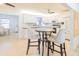 Dining area with bar-height table and seating, with view to the kitchen at 113 Maplewood Ave, Clearwater, FL 33765