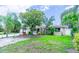 Inviting single-Gathering home with a well-maintained lawn and mature landscaping at 113 Maplewood Ave, Clearwater, FL 33765