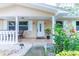 Inviting front porch with white columns, neutral paint, and quaint walkway at 113 Maplewood Ave, Clearwater, FL 33765