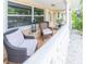 Inviting front porch with comfortable seating at 113 Maplewood Ave, Clearwater, FL 33765