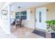 Charming front porch with tiled floor, columns, and seating at 113 Maplewood Ave, Clearwater, FL 33765