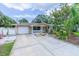 Charming single-story home with well-manicured landscaping and a spacious driveway at 113 Maplewood Ave, Clearwater, FL 33765