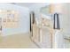 Hallway view featuring decorative mirror and cabinet with table lamp at 113 Maplewood Ave, Clearwater, FL 33765