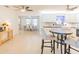 Open-concept floor plan with a breakfast bar leading to a bright dining area and modern kitchen at 113 Maplewood Ave, Clearwater, FL 33765