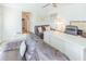 Comfortable living room with hardwood floors, neutral colors, comfortable seating, and a home office area at 113 Maplewood Ave, Clearwater, FL 33765