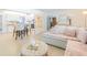 Open-concept living space with a view of the kitchen, dining area, and living room with tile floors at 113 Maplewood Ave, Clearwater, FL 33765