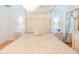 Charming main bedroom with a four-poster bed, soft lighting, and elegant decor at 113 Maplewood Ave, Clearwater, FL 33765