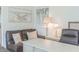 Cozy office space with leather sofa, decorative art, and built-in workstation at 113 Maplewood Ave, Clearwater, FL 33765