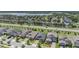 Aerial view of a neighborhood featuring lush green landscaping and a lake at 11315 Chilly Water Ct, Riverview, FL 33579